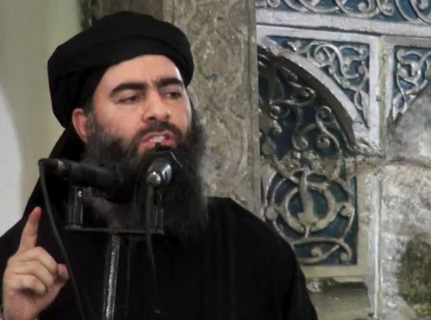 FILE - This file image made from video posted on a militant website Saturday, July 5, 2014, purports to show the leader of the Islamic State group, Abu Bakr al-Baghdadi, delivering a sermon at a mosque in Iraq during his first public appearance. How rooted in Islam is the ideology embraced by the Islamic State group that has inspired so many to fight and die? The group has assumed the mantle of Islam's earliest years, claiming to recreate the conquests and rule of the Prophet Muhammad and his successors. But in reality its ideology is a virulent vision all its own, one that its adherents have plucked from centuries of traditions. (AP Photo/Militant video, File)