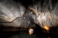 Tourists explore a cave at the Puerto Princesa Subterranean River National Park in Palawan, Philippines