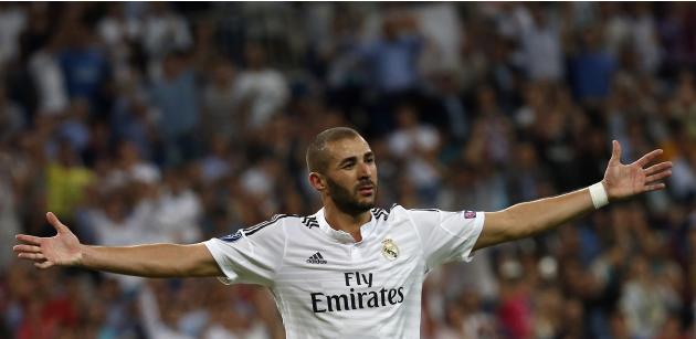 Real Madrid's Benzema celebrates after scoring a goal against Basel during their Champions League soccer match in Madrid