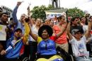 Opposition supporters in wheelchairs arrive from the   state of Lara to a gathering with Tintori, wife of jailed Venezuelan opposition   leader Lopez in Caracas