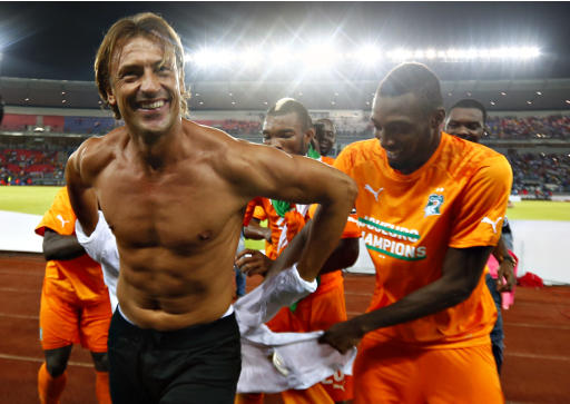 Ivory Coast's players take off shirt of their head coach Renard after winning the African Nations Cup final soccer match against Ghana in Bata