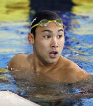 In this Sept. 24, 2014 photo, Japan's Naoya Tomita reacts after his men's 100m breaststroke final at the 17th Asian Games in Incheon, South Korea. Tomita, the 200-meter breaststroke gold medalist from the previous Asian Games, could face criminal charges for allegedly stealing a camera owned by a South Korean media organization, team officials announced Saturday, Sept. 27. (AP Photo/Kyodo News) JAPAN OUT, CREDIT MANDATORY