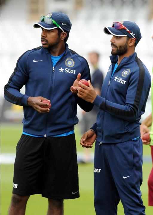 India's Varun Aaron, left, and Ravindra Jadeja during net practice for the first Test between England and India at Trent Bridge cricket ground, Nottingham, England, Tuesday, July 8, 2014. England 