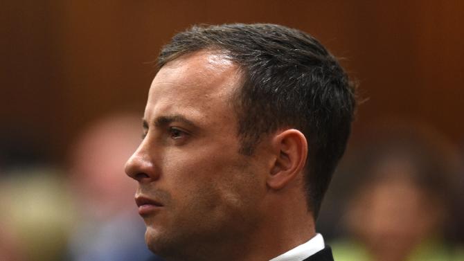 South African paralympian athlete Oscar Pistorius listening at the High Court in Pretoria on September 11, 2014