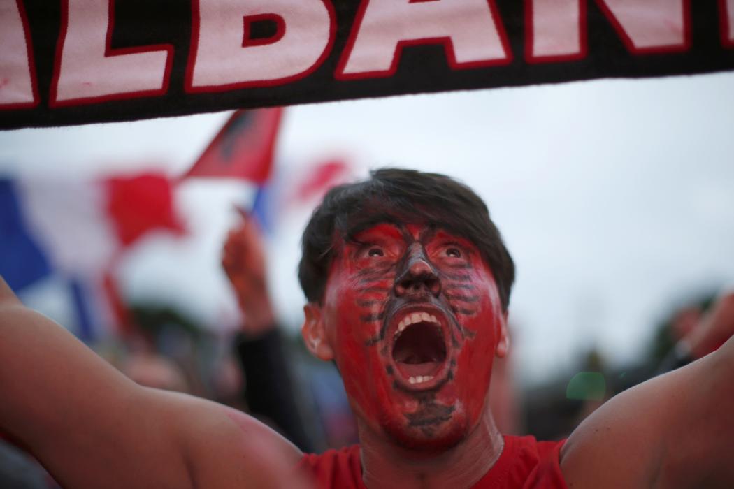 An Albania fan cheers in the fan zone to watch EURO 2016 match in Nice