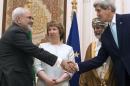 U.S. Secretary of State Kerry and Iranian FM Zarif shake hands as Omani FM Alawi and EU envoy Ashton watch in Muscat