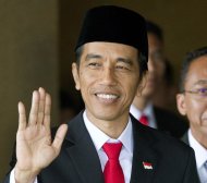Joko Widodo waves ahead of his swearing in as Indonesia's seventh president at Parliament in Jakarta, Indonesia, Monday, Oct. 20, 2014. (AP Photo/Mark Baker)