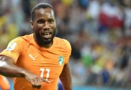 Ivory Coast's captain Didier Drogba celebrates after teammate Gervinho scores a goal vs Japan, in their FIFA Would Cup Group C match, at the Pernambuco Arena in Recife, on June 14, 2014