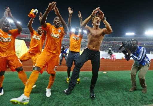 Ivory Coast's head coach Renard celebrates and dances with his players after winning the African Nations Cup final match against Ghana in Bata