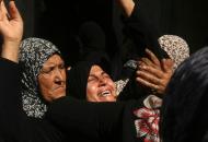 The sister of Palestinian Ahmed al-Serhi, who was killed in clashes with Israeli forces, mourns at his funeral in Deir al-Balah, Gaza, on October 21, 2015