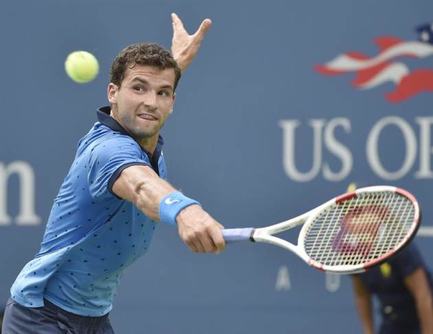 AHG. Flushing Meadows (United States), 02/09/2014.- Grigor Dimitrov of Bulgaria hits a return to Gael Monfils of France on the ninth day of the 2014 US Open Tennis Championship at the USTA National Te