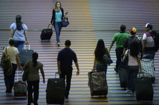 Pasajeros en el aeropuerto internacional de Maiquetía en Caracas el 3 de julio de 2014