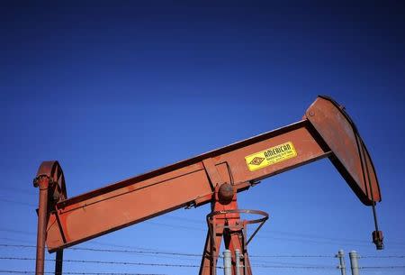 An oil well pump jack is seen at an oil field supply yard near Denver, Colorado February 2, 2015. REUTERS/Rick Wilking