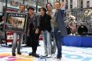 Journey band members pose together after performing   on NBC's Today Show in New York