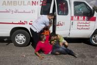 A wounded Palestinian demonstrator is helped into an ambulance during clashes with Israeli troops near Ramallah, West Bank, Tuesday, Sept. 29, 2015. Palestinian demonstrators clashed with Israeli troops across the West Bank on Tuesday as tensions remained high following days of violence at Jerusalem’s most sensitive holy site, revered by Jews as the Temple Mount and by Muslims as the Noble Sanctuary. (AP Photo/Majdi Mohammed)