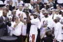 Miami Heat's Greg Oden lifts the Eastern Conference championship trophy on Friday, May 30, 2014, in Miami. The Heat defeated the Indiana Pacers 117-92 to advance to the NBA Finals
