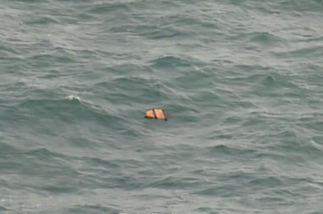 This aerial view taken from an Indonesian search and rescue aircraft over the Java Sea shows floating debris spotted in the same area as other items being investigated by Indonesian authorities as possible objects from missing AirAsia flight QZ8501