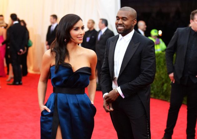 Kim Kardashian (L) and Kanye West attend the "Charles James: Beyond Fashion" Costume Institute Gala at the Metropolitan Museum of Art on May 5, 2014 in New York City