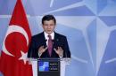 Turkish Prime Minister Davutoglu addresses a news   conference after meeting NATO Secretary-General Stoltenberg at the Alliance's   headquarters in Brussels