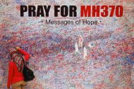 Governments pledge to continue search for MH370