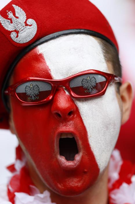 Poland fan with face paint before the game