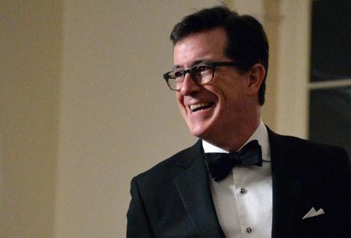 Comedian Stephen Colbert arrives at the White House in Washington on February 11, 2014