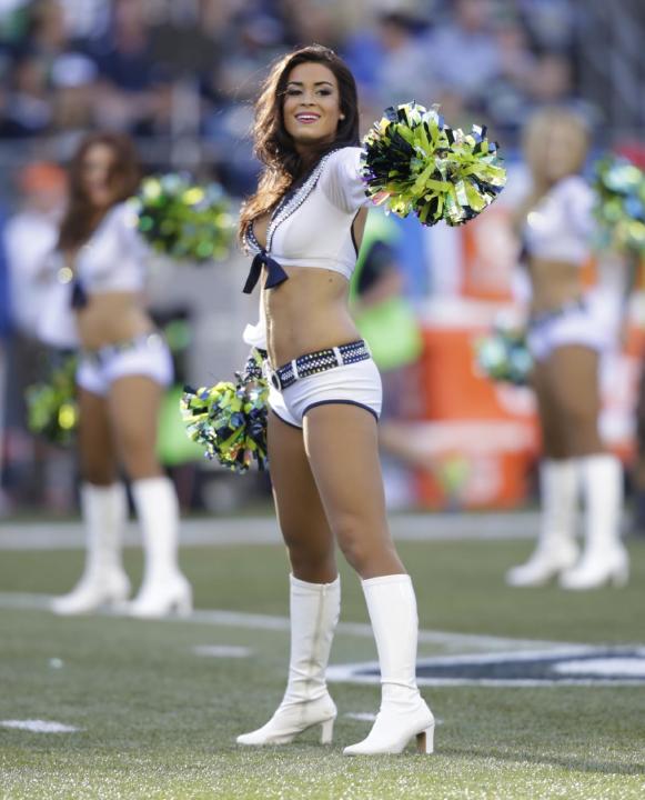 Seattle Seahawks Sea Gals cheerleaders perform in the first half of an NFL football game between the Seattle Seahawks and the Green Bay Packers, Thursday, Sept. 4, 2014, in Seattle. (AP Photo/Stephen 