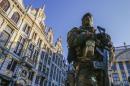 A Belgian soldier patrols in Brussels' Grand   Place as police searched the area during a continued high level of security   following the recent deadly Paris attacks