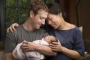 In this undated photo provided by Mark Zuckerberg, Max Chan Zuckerberg is held by her parents, Mark Zuckerberg and Priscilla Chan Zuckerberg. Facebook CEO Mark Zuckerberg and his wife announced the birth of their daughter, Max, as well as plans to donate most of their wealth to a new organization that will tackle a broad range of the world's ills. (Mark Zuckerberg via AP)