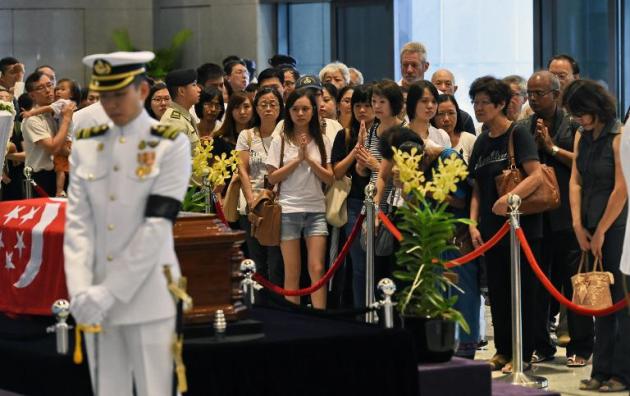 Singapore overwhelmed by huge crowds mourning founding leader Lee.