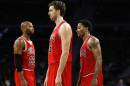 Chicago Bulls forward Taj Gibson, from left, Pau Gasol and Derrick Rose take the court against the Detroit Pistons in the first half of a preseason NBA basketball game in Auburn Hills, Mich., Tuesday, Oct. 7, 2014. (AP Photo/Paul Sancya)