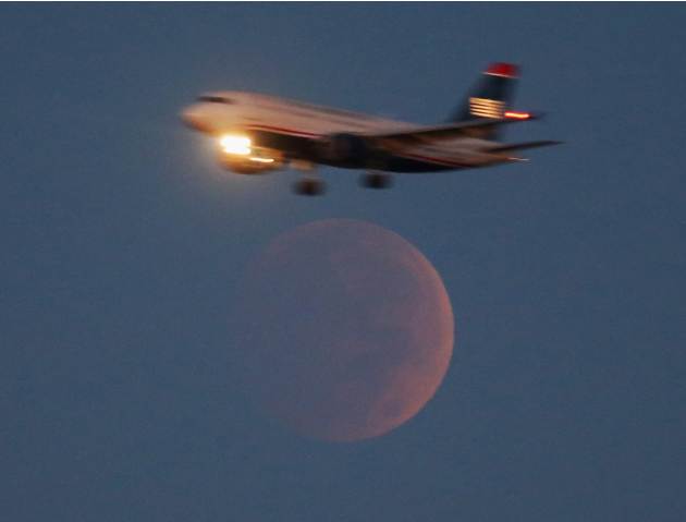 Full Lunar Eclipse Visible As Moon Aligns Into Earth's Shadow
