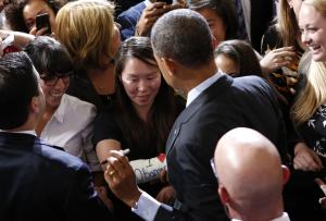 U.S. President Obama signs the cast of Cathey Park …