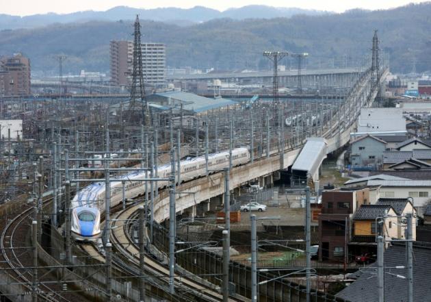 Two are feared dead in Japan after an apparent suicide attempt on board a moving shinkansen bullet train, similar to this one pictured