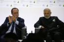 French President Francois Hollande and India's   Prime Minister Narendra Modi attend the launching of the International Solar   Alliance on the opening day of the World Climate Change Conference 2015 at Le   Bourget