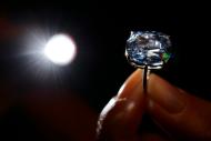 Property tycoon Joseph Lau bought the 12.03-carat blue diamond at a Sotheby's auction and immediately renamed it "The Blue Moon of Josephine" after his seven-year-old daughter