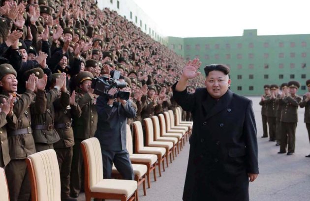 North Korean leader Kim Jong-Un (C) waves to participants of the third meeting of battalion commanders and political instructors of the Korean People's Army in Pyongyang on November 4, 2014