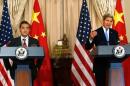 U.S. Secretary of State Kerry delivers remarks as China's Foreign Minister Wang looks on, before their meeting in Washington