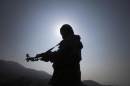 Pakistani soldier is seen silhouetted while posing   for the media during an operation organized by the army, in South Waziristan