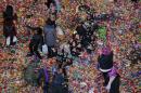 Revelers play in confetti on the streets during New   Year's festivities inside Times Square in New York