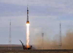 The Soyuz TMA-18M spacecraft carrying the crew of Aidyn Aimbetov of Kazakhstan, Sergei Volkov of Russia and Andreas Mogensen of Denmark blasts off from the launch pad at the Baikonur cosmodrome