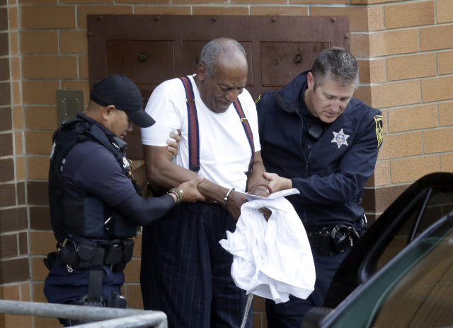 Bill Cosby is escorted out of the Montgomery County Correctional Facility, Tuesday Sept. 25, 2018, in Eagleville, Pa., following his sentencing to three-to-10-year prison sentence for sexual assault. (AP Photo/Jacqueline Larma)