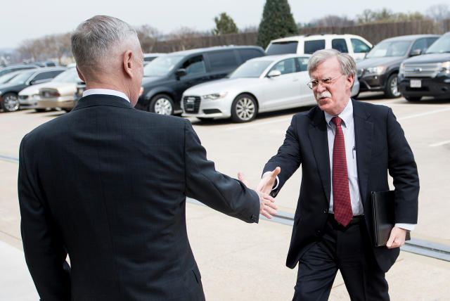 Secretary of Defense Jim Mattis, left, greets incoming national security adviser John Bolton outside the Pentagon on March 29. Bolton's new deputy had been a thorn in Mattis' side when he was filling out his staff. (BRENDAN SMIALOWSKI via Getty Images)