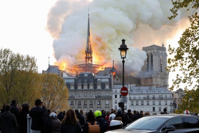 Seen from across the Seine River, smoke and flames rise during a fire at the landmark Notre-Dame Cathedral in central Paris on April 15, 2019, potentially involving renovation works being carried out at the site, the fire service said. (Photo by FRANCOIS GUILLOT / AFP) (Photo credit should read FRANCOIS GUILLOT/AFP/Getty Images)