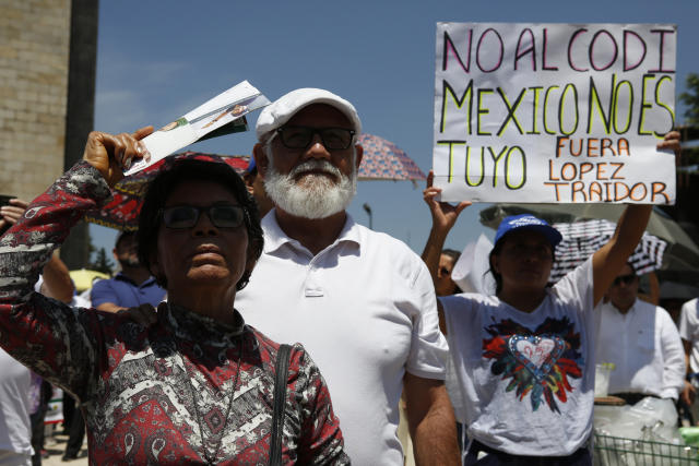 Protesters march against the policies of Mexican President Andrés Manuel López Obrador during his first state of the nation address in Mexico City, Sunday, Sept. 1, 2019. (AP Photo/Ginnette Riquelme)