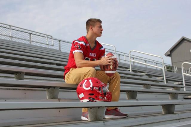 Maison Hullibarger, who died suddenly on Dec. 4, 2018, sits in the stands of Bedford High School in Temperance, Mich.