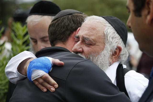 Rabbi Yisroel Goldstein hugs a member of the congregation of Chabad of Poway the day after a deadly shooting took place there, on Sunday, April 28, 2019 in Poway, Calif. (Photo: TNS via ZUMA Wire)