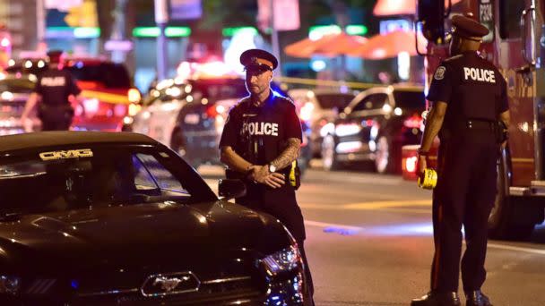 Police work the scene of a shooting in Toronto on Sunday, July 22, 2018. [AP)