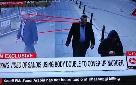 CNN pictures body double Saudi had apparently employed. Man with fake beard and wearing same clothes as Khashoggi caught on CCTV leaving the consulate - Credit: CNN