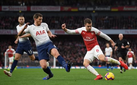 Aaron Ramsey of Arsenal is challenged by Jan Vertonghen of Tottenham Hotspur during the Premier League match between Arsenal FC and Tottenham Hotspur at Emirates Stadium on December 02, 2018 in London, United Kingdom - Credit:  Getty Images